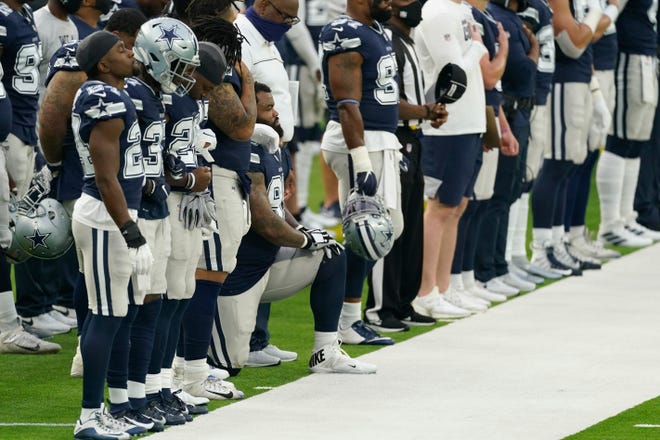 Dontari Poe becomes first Dallas Cowboys player to kneel during national anthem