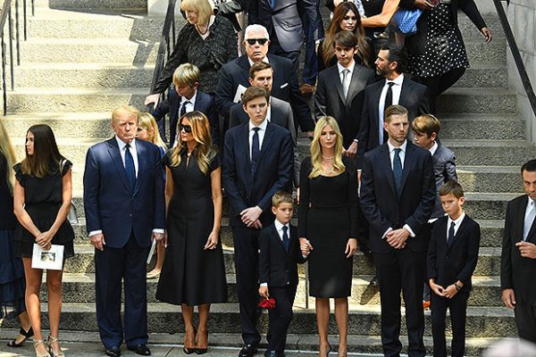 Barron Trump is flanked by members of the extended Trump family at the July 20, 2022 funeral of Ivana Trump. 