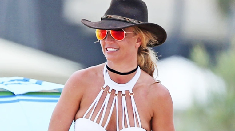 Britney Spears Rolls Around The Ocean In Just Her Bikini Bottoms In New Honeymoon Video