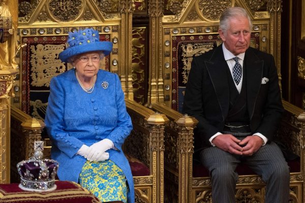 Queen Elizabeth II and her son Charles attend the State Opening of Parliament in 2017.