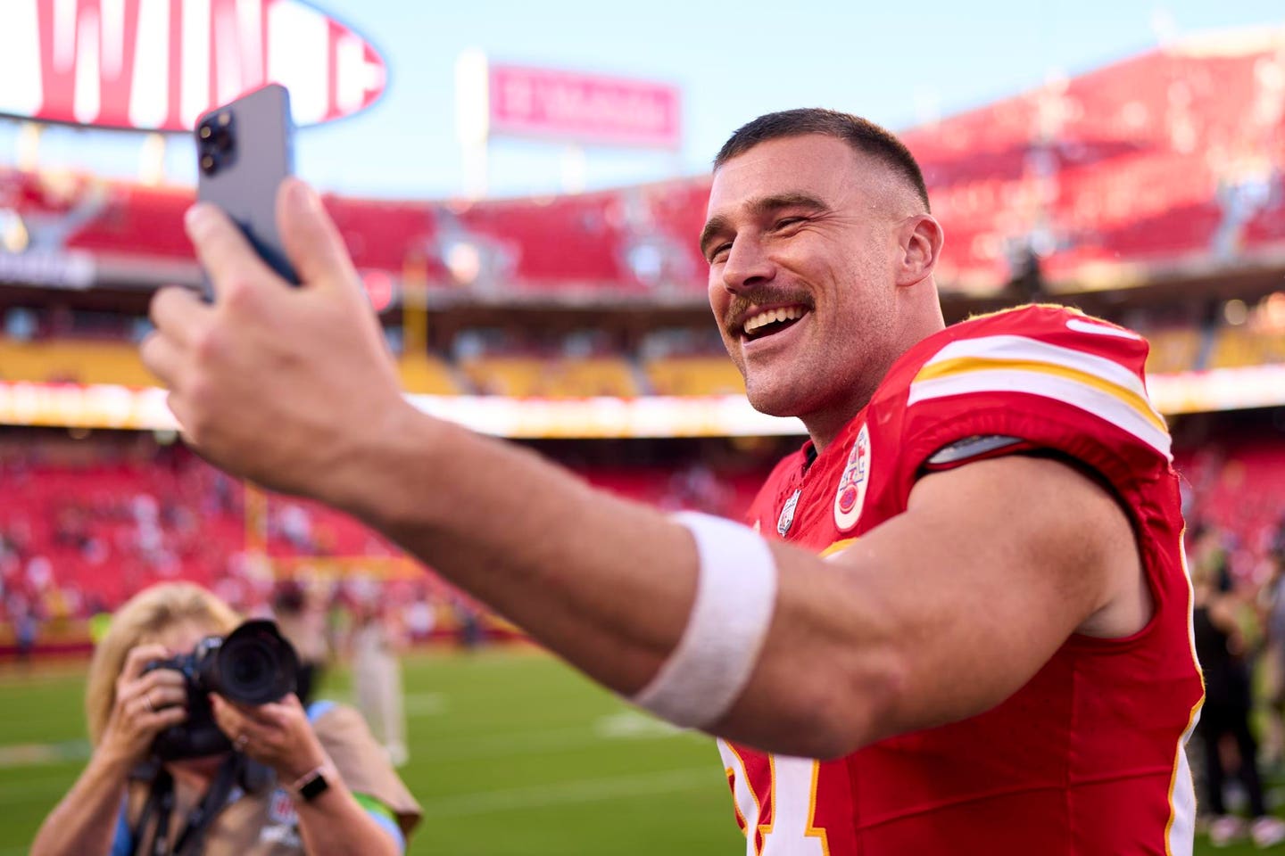 Travis Kelce smiled for all the cameras after Swift attended the Chiefs' 41-10 blowout of the Chicago Bears.