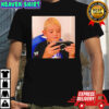 Dominik Mysterio wearing his younger self playing the PSP shirt
